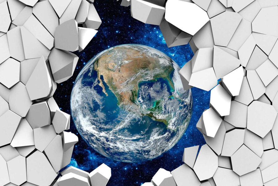 Planet earth breaking through a hole in the wall Planet earth breaking through a hole in the wall