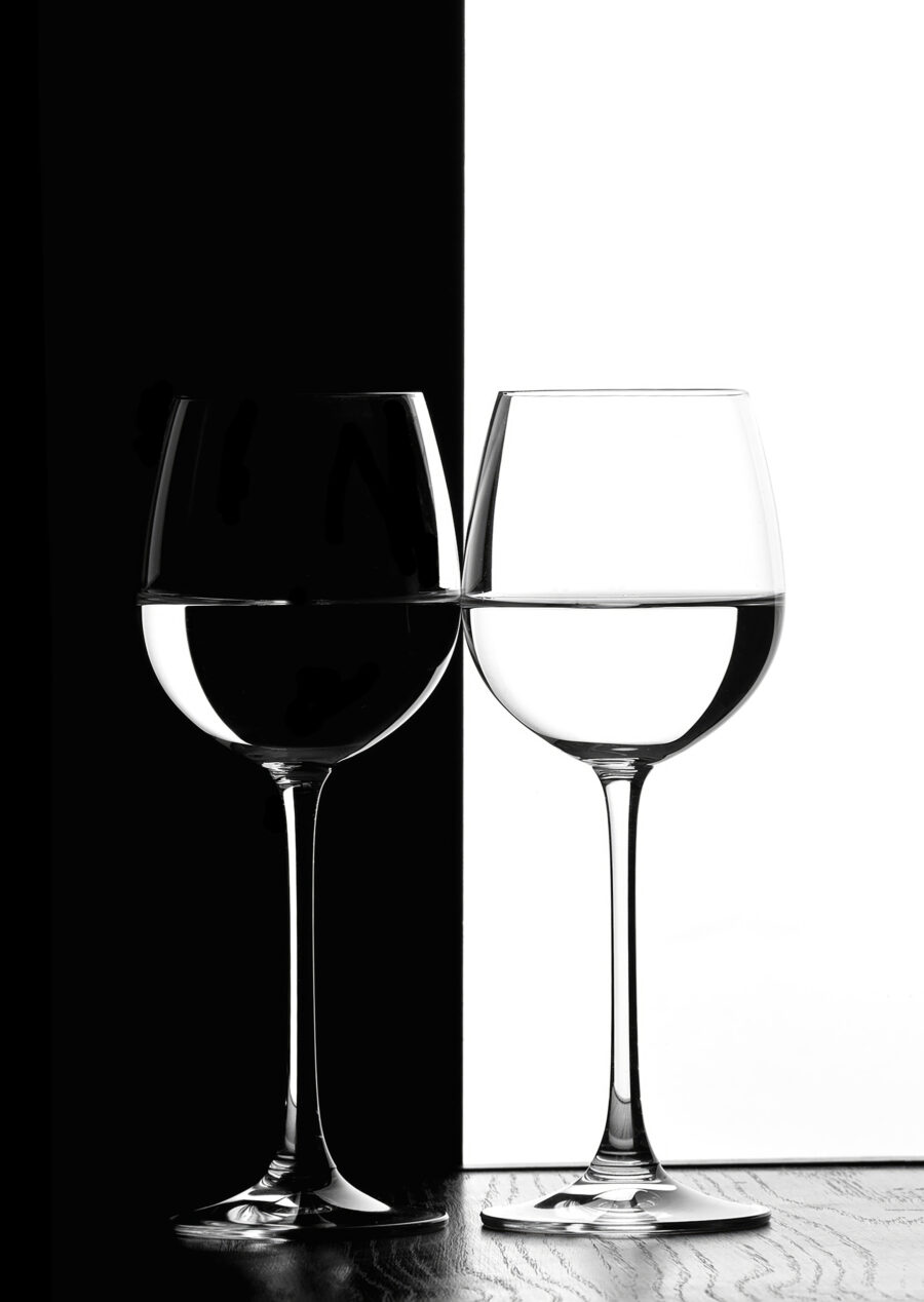 Two wine glasses with water in them