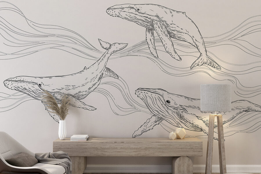 A group of whales swimming in the water