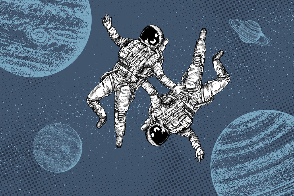 Two astronauts floating in space Two astronauts floating in space