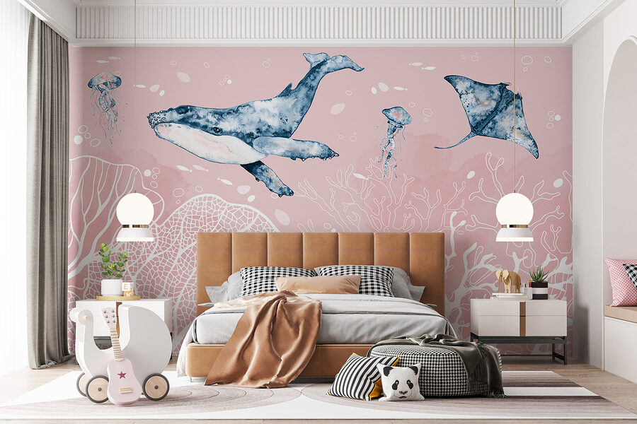 A whale and stingrays swimming in the ocean A whale and stingrays swimming in the ocean