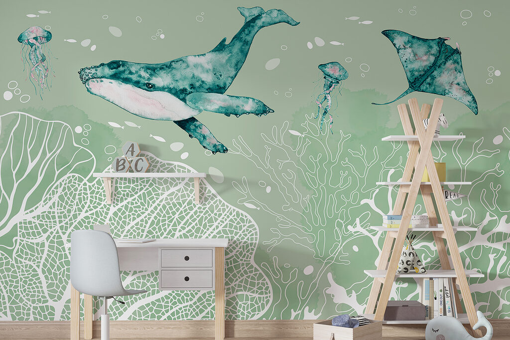 A whale and stingrays swimming in the ocean