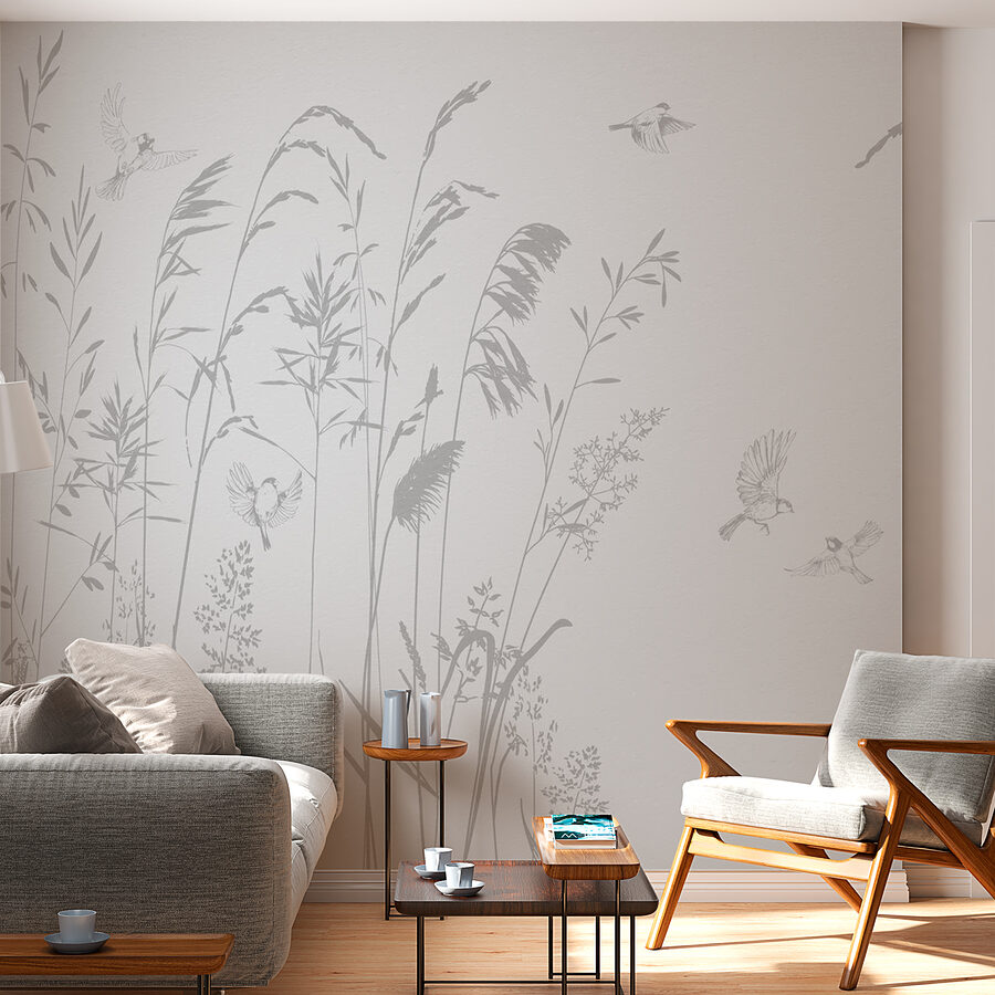 Birds flying over tall grass