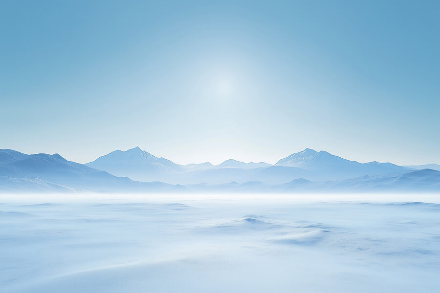 Snowy landscape with mountains in the distance
