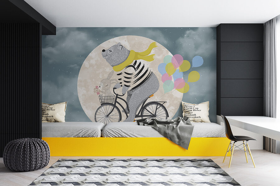 Bear riding a bicycle with balloons
