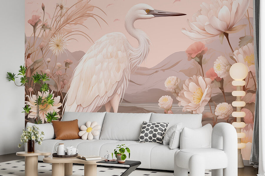 White bird standing on rocks surrounded by flowers