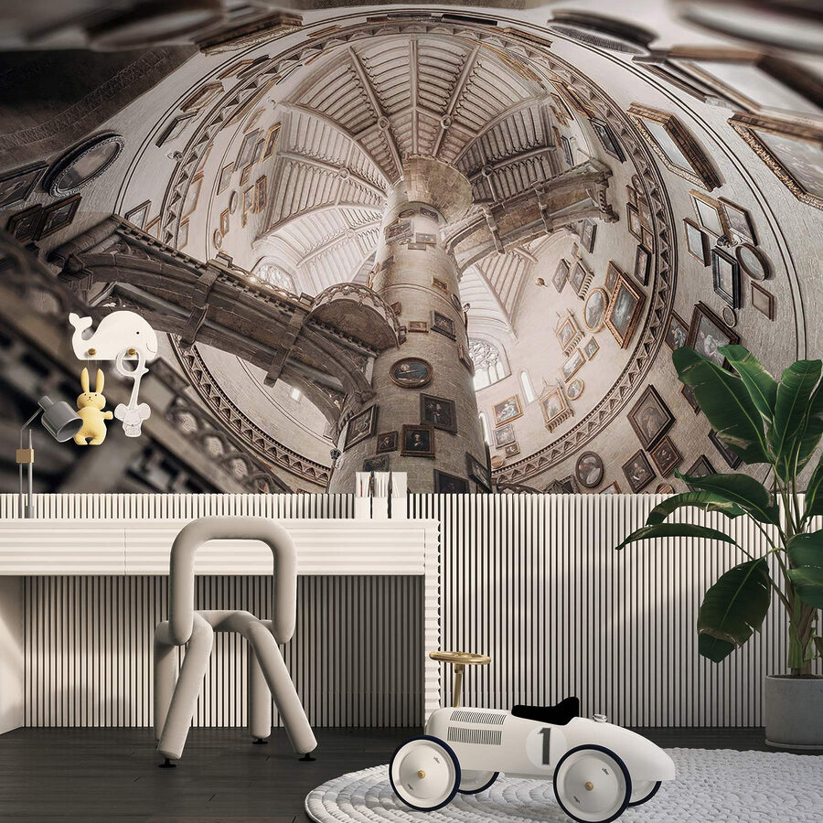 Circular building with multiple staircases and pictures on the walls