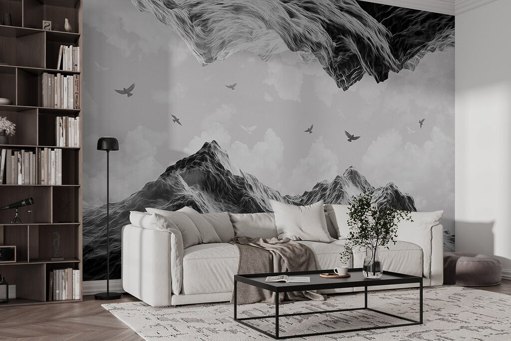 Group of birds flying over a mountain