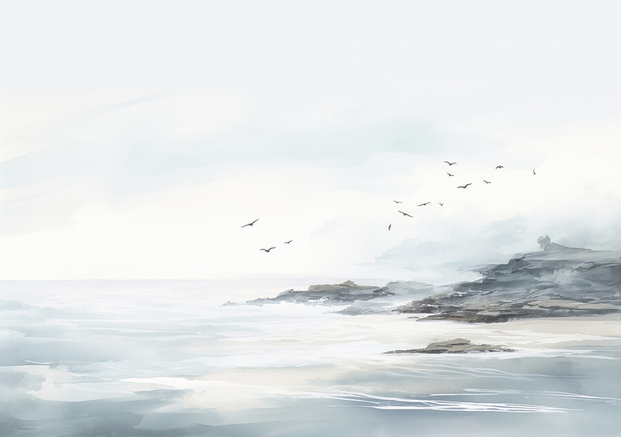 Birds flying over a rocky beach