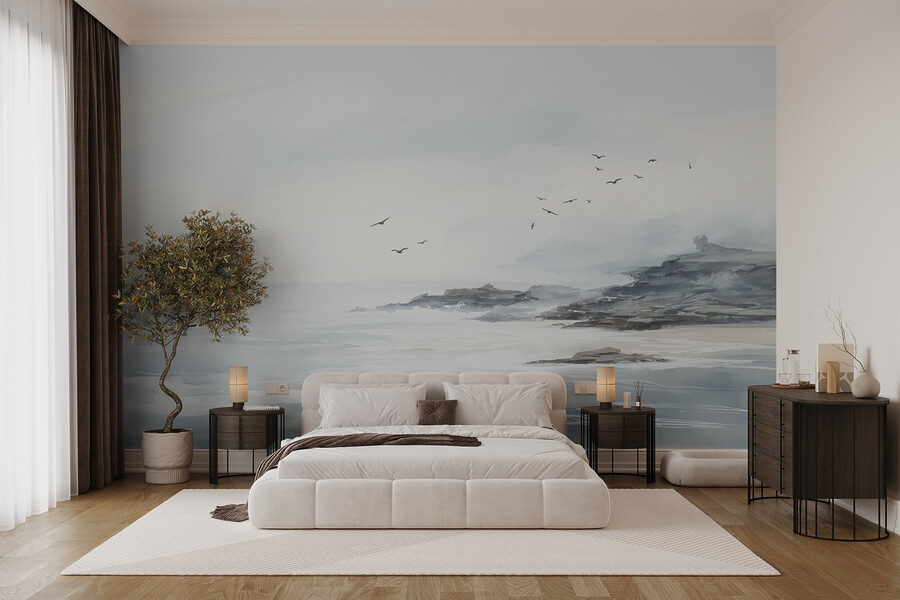 Birds flying over a rocky beach
