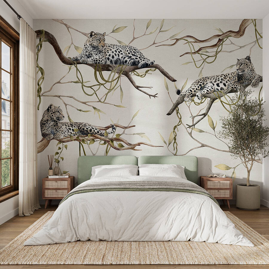 Group of leopards lying on branches