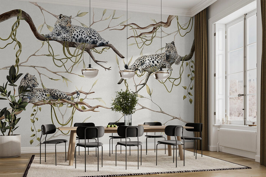 Group of leopards lying on branches