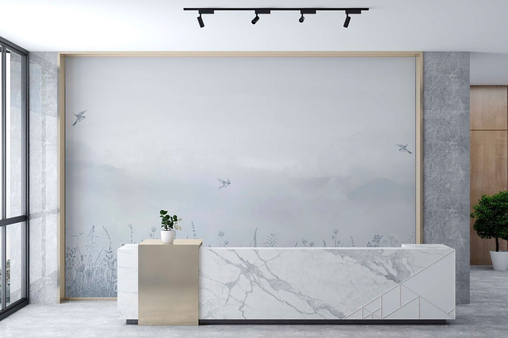 Bird flying over a field of flowers