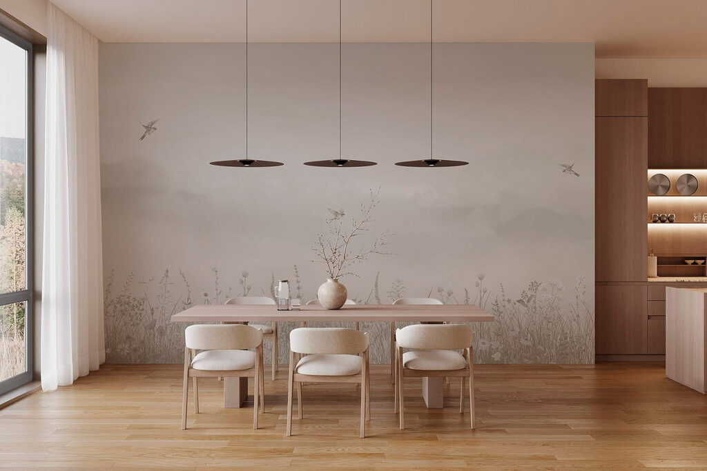 Bird flying over a field of flowers