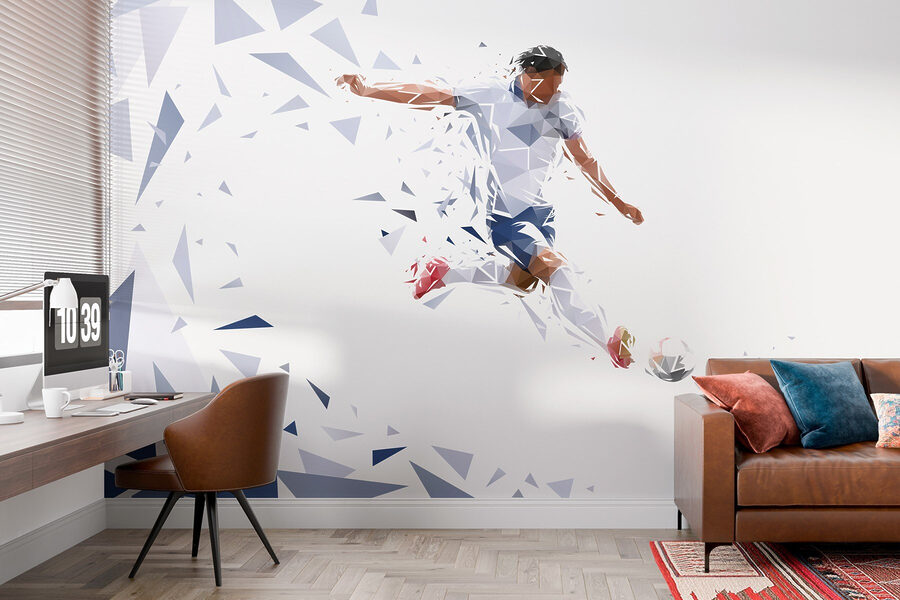 Man kicking a football ball