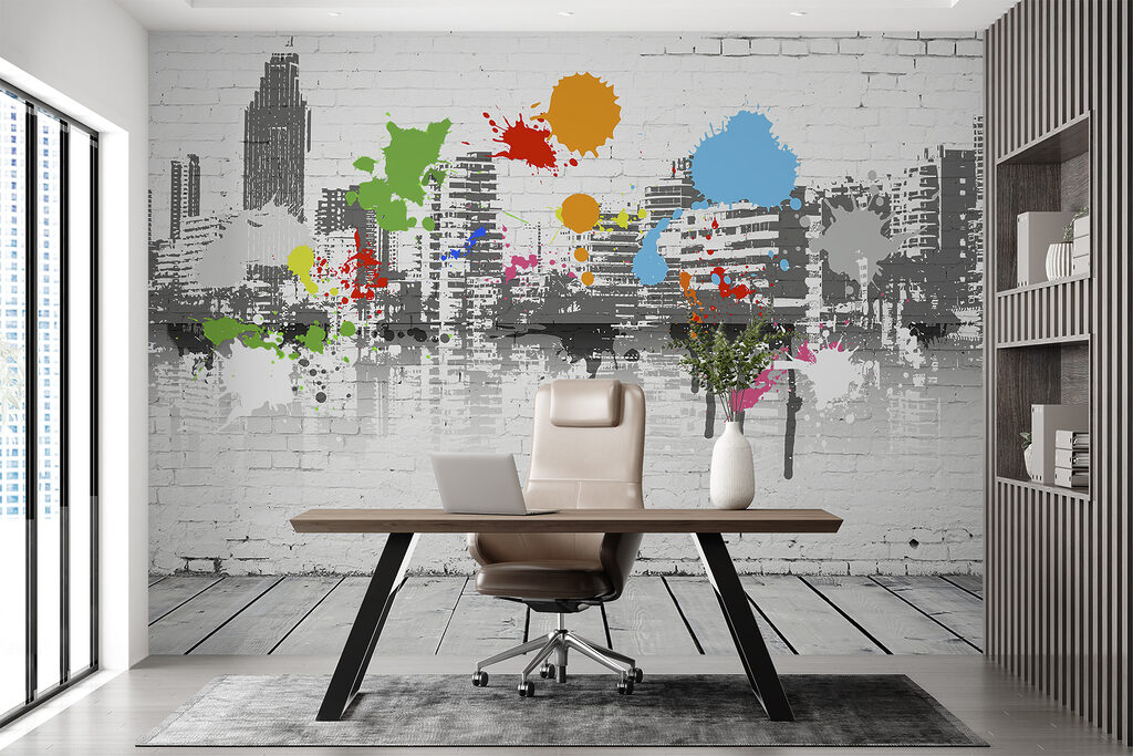 White brick wall with colorful paint splatters