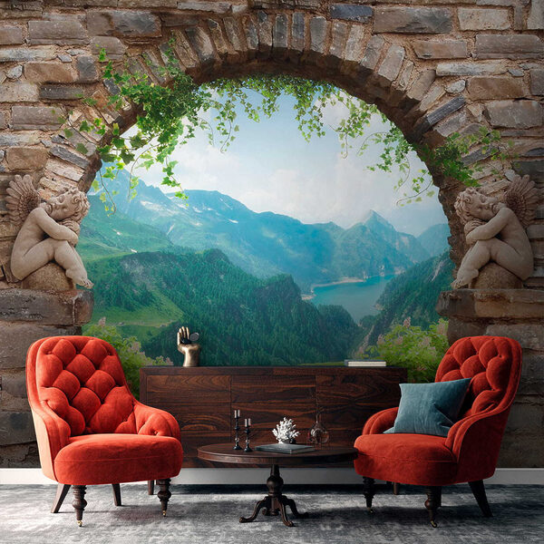Stone archway with stone statues and a view of a valley and mountains Stone archway with stone statues and a view of a valley and mountains