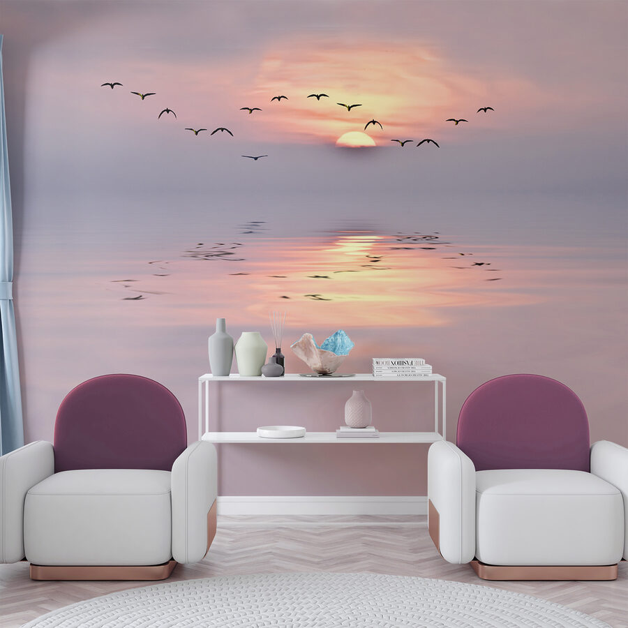 Flock of birds flying over water