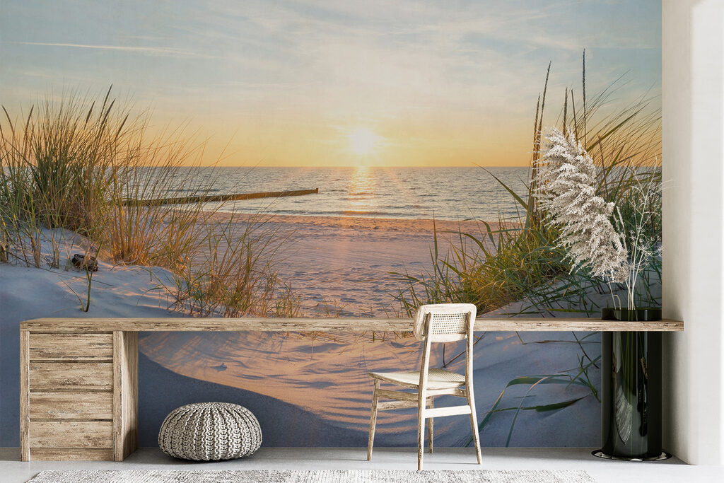 Beach with grass and a body of water Beach with grass and a body of water