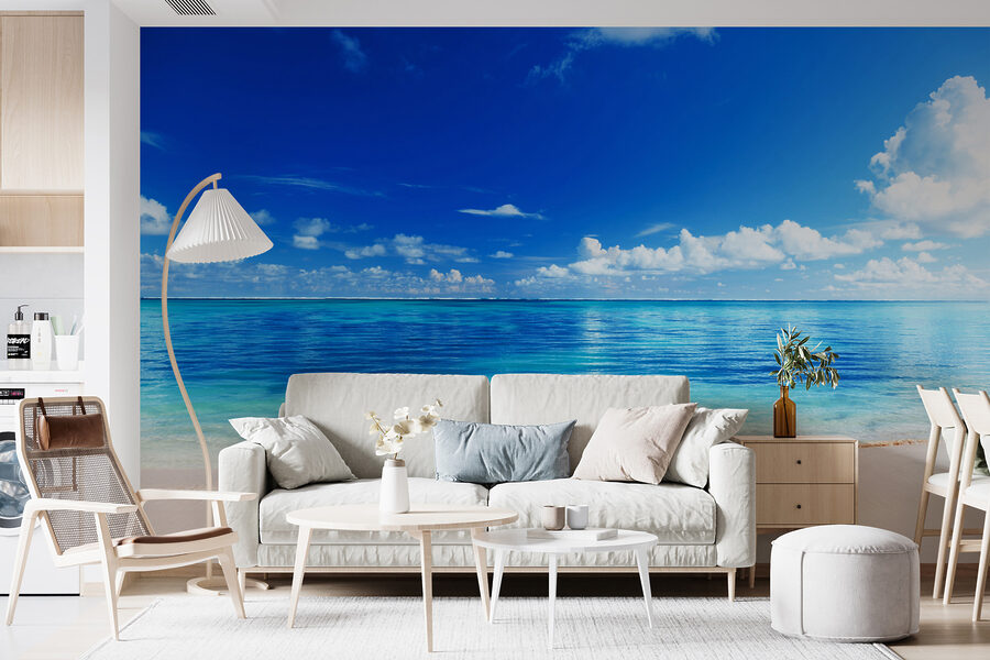 Beach with blue water and clouds