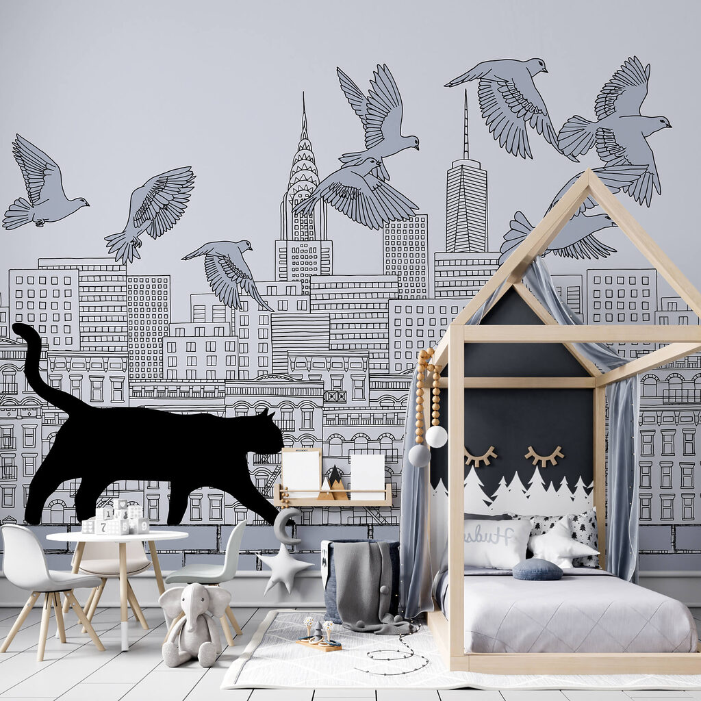 Cat walking on a wall with birds flying in the sky