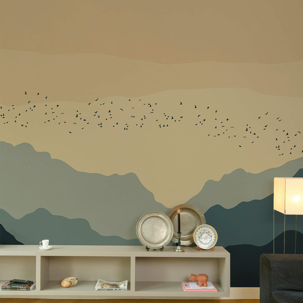 Group of birds flying over mountains