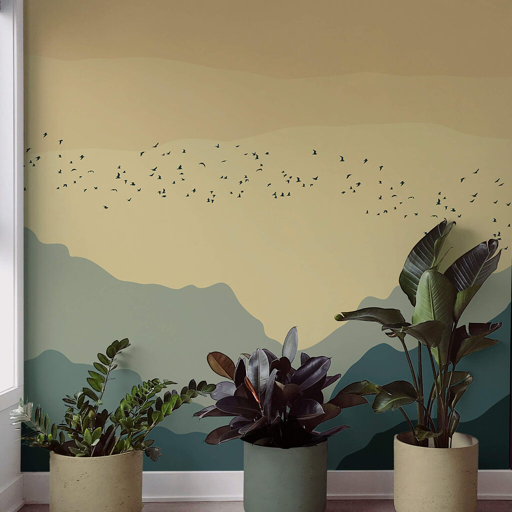 Group of birds flying over mountains