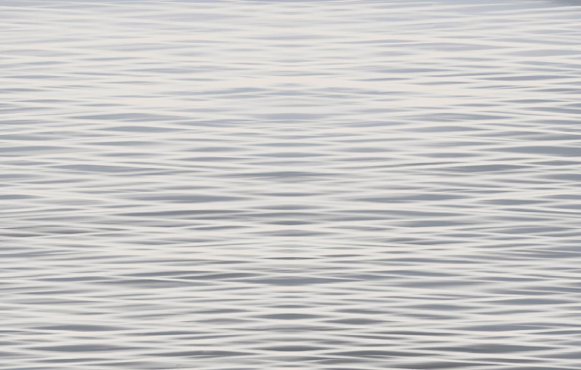 Waves dancing on a tranquil surface t00254p - Waves dancing on a tranquil surface