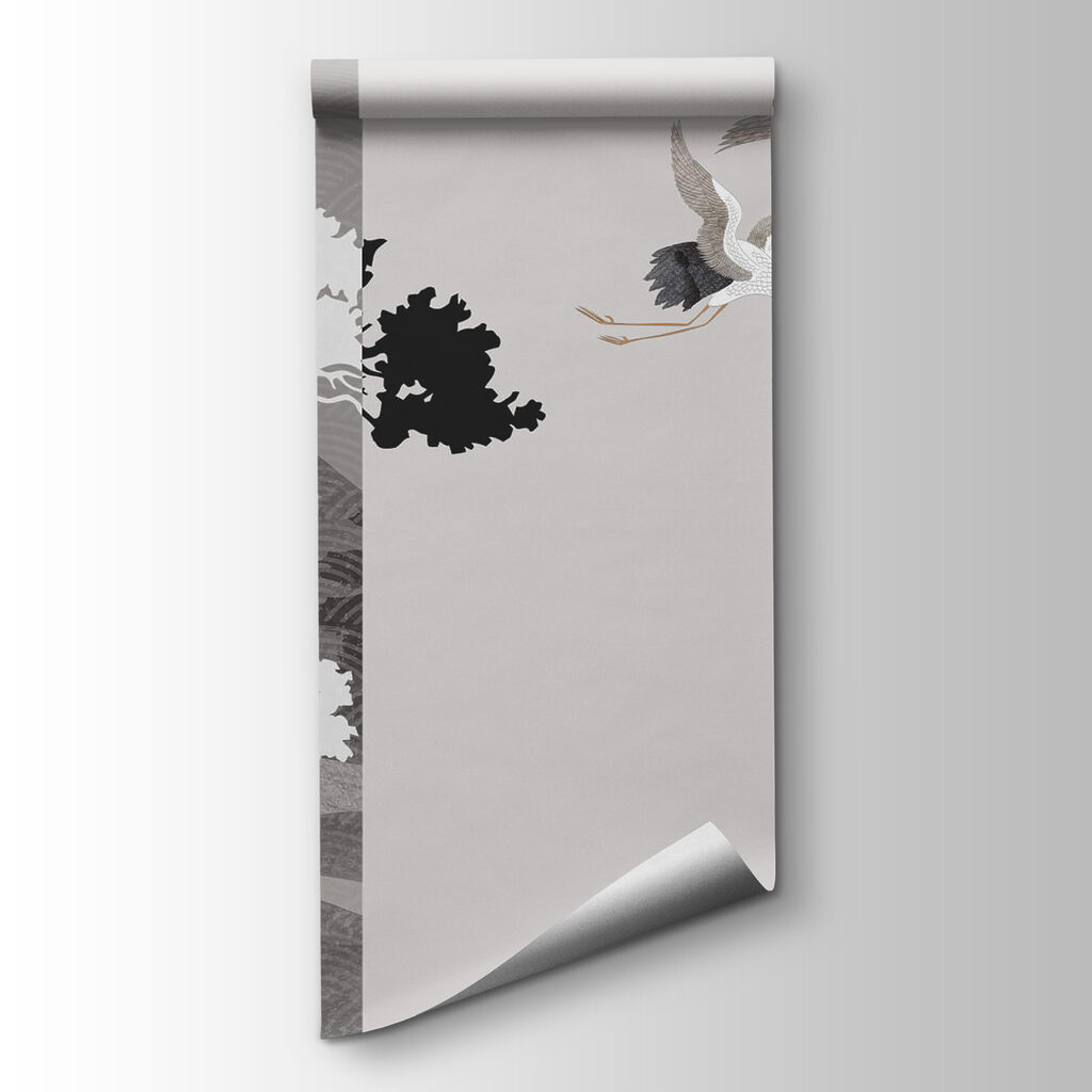 Couple of cranes flying next to a tree