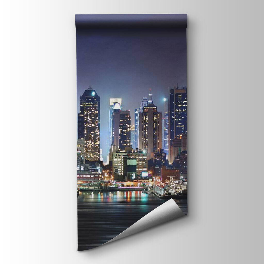 City skyline at night with lights reflecting on water City skyline at night with lights reflecting on water