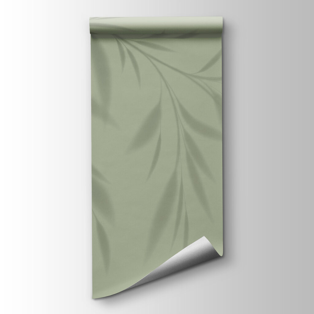 A shadow of a plant on a wall