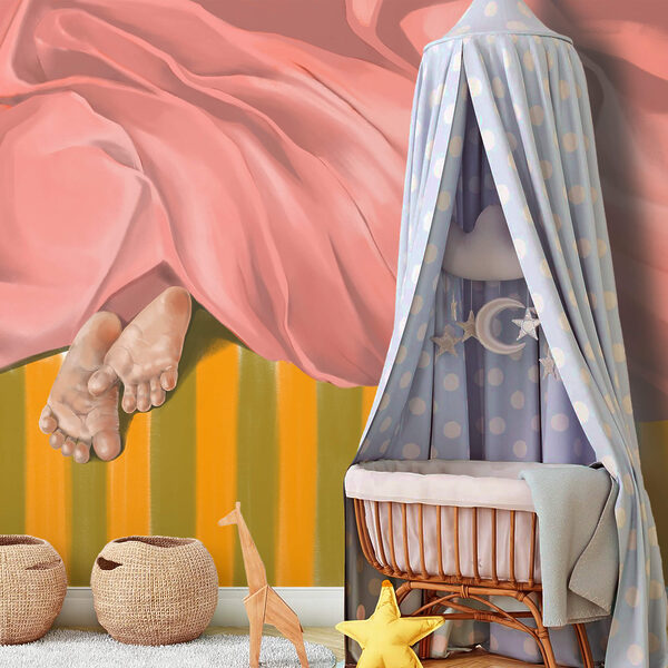 Pair of feet under a pink blanket